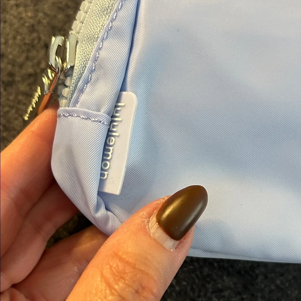 Lululemon Athletica Sky Blue Cosmetic Bag Gummy logo silver hardware.